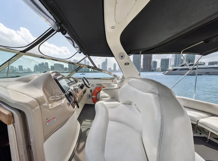 Genesis Yacht Photos Pics Interior view of 2003 Sea Ray 380 Sundancer yacht with city skyline backdrop.