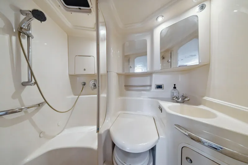 Genesis Yacht Photos Pics Luxurious bathroom in 2003 Sea Ray 380 Sundancer yacht with shower and vanity.