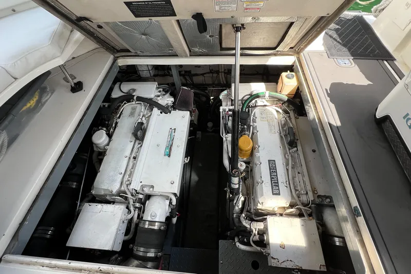 Genesis Yacht Photos Pics Engine compartment of a 2003 Sea Ray 380 Sundancer boat, showcasing dual engines.