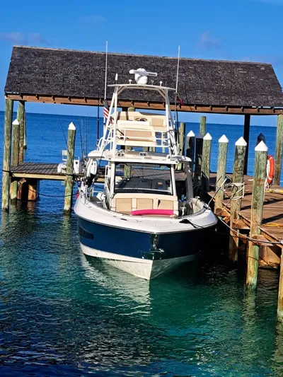 The Reel Deal Yacht Photos Pics 2016 Boston Whaler 420 Outrage docked at a marina.