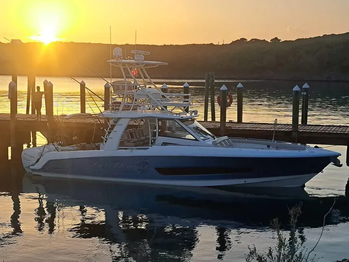 The Reel Deal Yacht Photos Pics 2016 Boston Whaler 420 Outrage docked at sunset.
