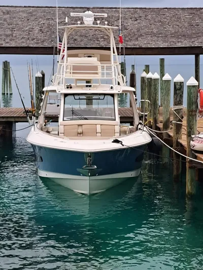 The Reel Deal Yacht Photos Pics 2016 Boston Whaler 420 Outrage docked at a marina.
