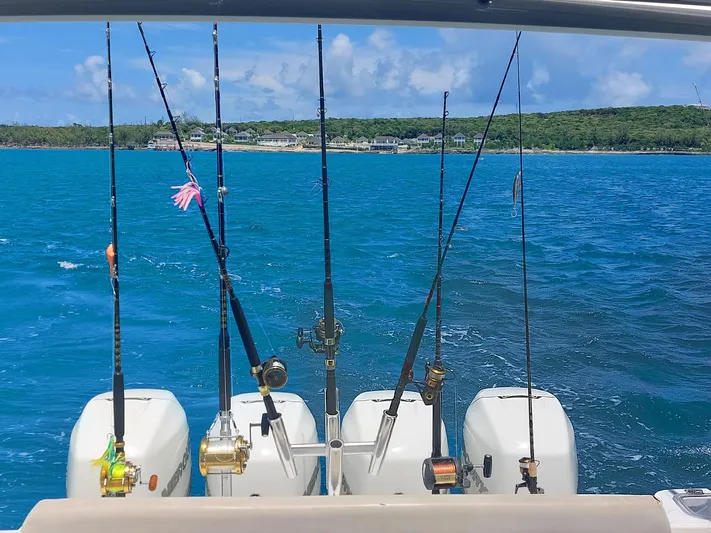 The Reel Deal Yacht Photos Pics Fishing rods on a 2016 Boston Whaler 420 Outrage boat in blue ocean.