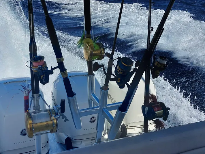 The Reel Deal Yacht Photos Pics Fishing rods on a 2016 Boston Whaler 420 Outrage in action on the ocean.