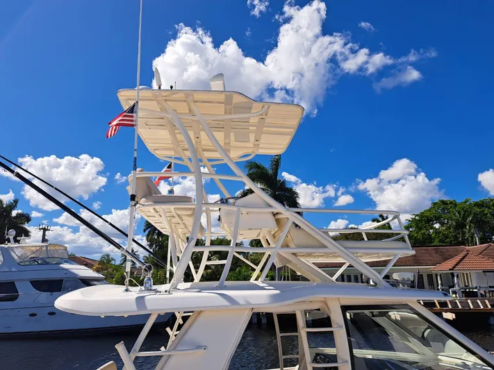 The Reel Deal Yacht Photos Pics 2016 Boston Whaler 420 Outrage boat docked under a clear blue sky.