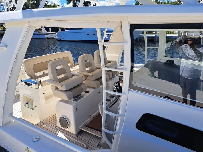 The Reel Deal Yacht Photos Pics 2016 Boston Whaler 420 Outrage boat interior with seating and ladder.