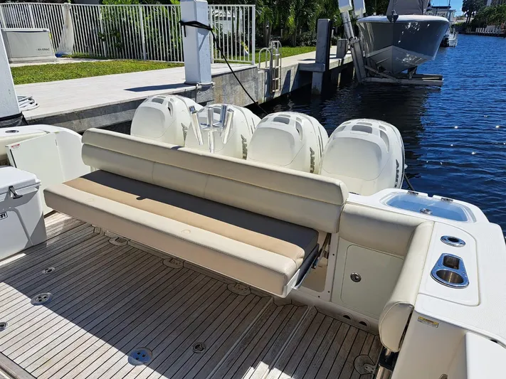 The Reel Deal Yacht Photos Pics 2016 Boston Whaler 420 Outrage boat with outboard engines and rear seating.