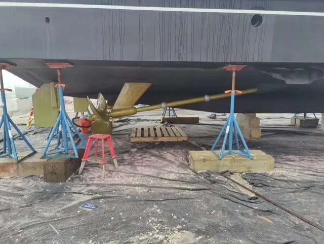  Yacht Photos Pics Cheoy Lee 68 yacht (2004) under maintenance, showing propeller and supports.