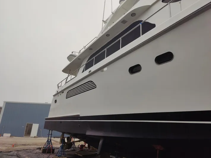  Yacht Photos Pics 2004 Cheoy Lee 68 yacht on dry dock, side view.