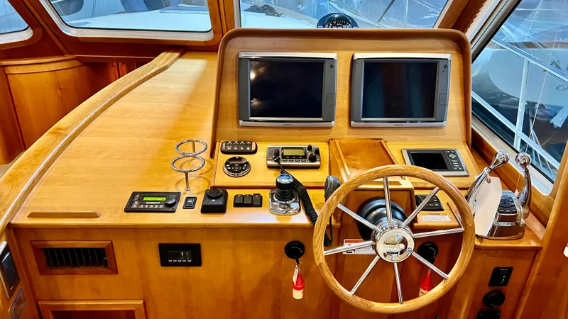 Tempest Yacht Photos Pics 2011 Sabre 40 Sedan helm with dual screens and wooden steering wheel.