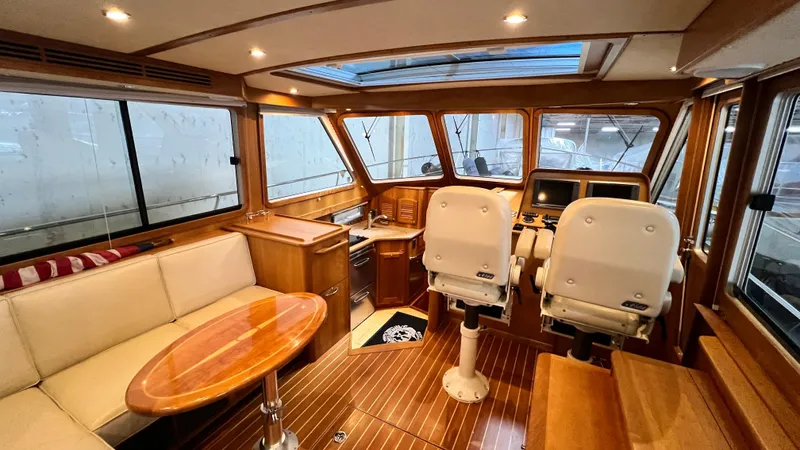 Tempest Yacht Photos Pics Interior of 2011 Sabre 40 Sedan yacht with wood finish and seating area.