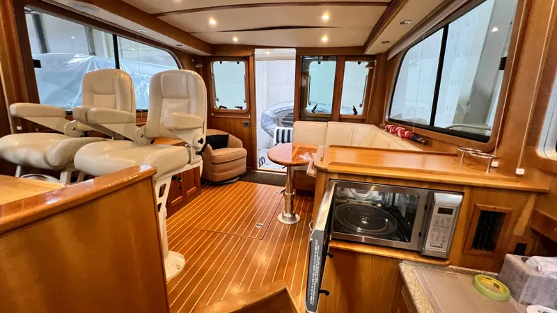 Tempest Yacht Photos Pics Interior of 2011 Sabre 40 Sedan yacht with luxurious seating and wooden finishes.