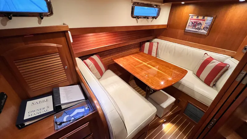 Tempest Yacht Photos Pics Luxurious 2011 Sabre 40 Sedan interior with elegant wood finish and cozy seating area.