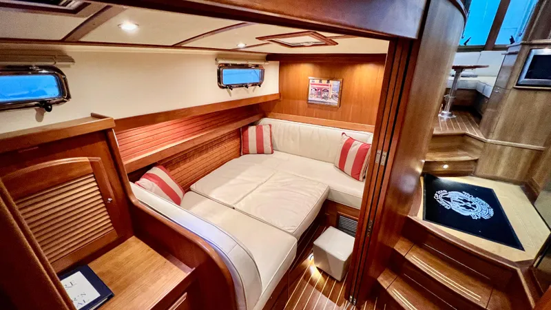 Tempest Yacht Photos Pics Luxurious interior of 2011 Sabre 40 Sedan yacht with cozy seating and elegant wood finish.