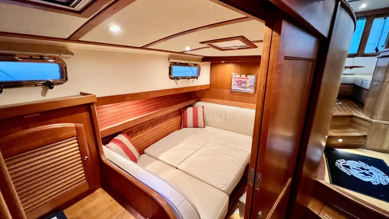 Tempest Yacht Photos Pics 2011 Sabre 40 Sedan interior with cozy seating and wooden accents.