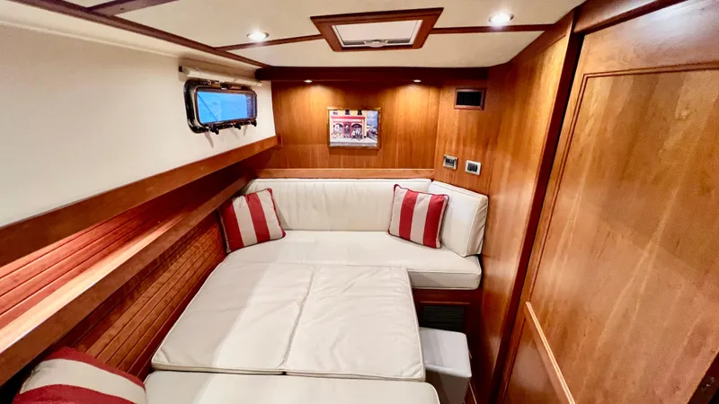Tempest Yacht Photos Pics Luxurious 2011 Sabre 40 Sedan interior with cozy seating and elegant wood finish.
