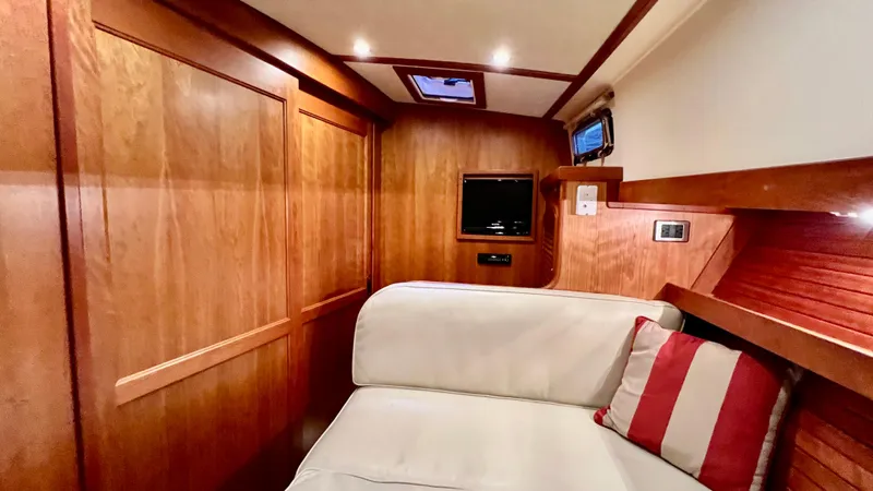 Tempest Yacht Photos Pics Interior of 2011 Sabre 40 Sedan with wood paneling and white cushioned seating.