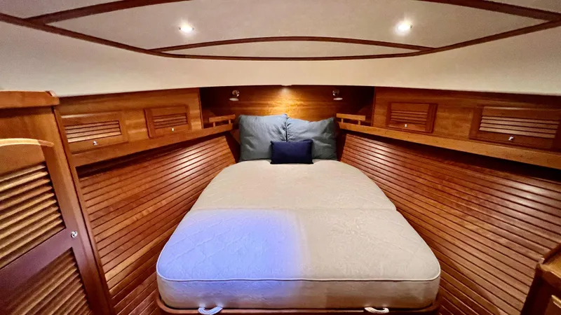 Tempest Yacht Photos Pics Luxurious 2011 Sabre 40 Sedan cabin with cozy bed and elegant wood paneling.