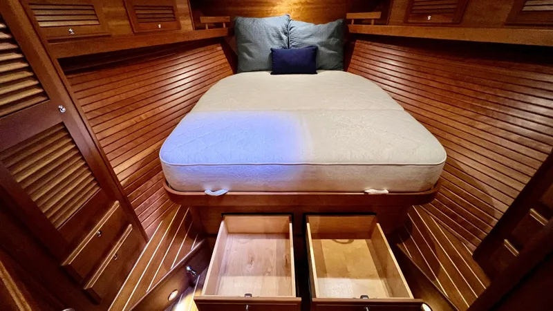 Tempest Yacht Photos Pics Luxurious 2011 Sabre 40 Sedan cabin with wooden interior and storage drawers.