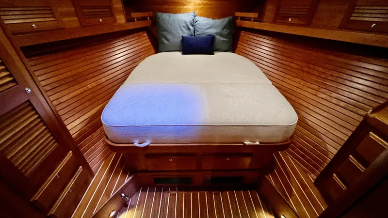 Tempest Yacht Photos Pics Luxurious 2011 Sabre 40 Sedan cabin with wooden interior and cozy bed.