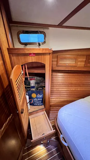 Tempest Yacht Photos Pics 2011 Sabre 40 Sedan cabin interior with wooden storage and bed.