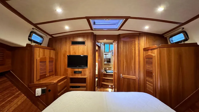 Tempest Yacht Photos Pics Luxurious interior of 2011 Sabre 40 Sedan yacht with wood paneling and modern amenities.