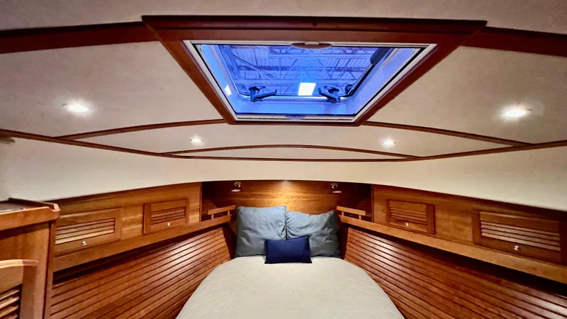 Tempest Yacht Photos Pics Luxurious 2011 Sabre 40 Sedan cabin interior with skylight and wooden paneling.