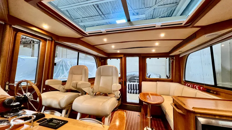 Tempest Yacht Photos Pics Luxurious interior of 2011 Sabre 40 Sedan yacht with leather seating and wood finishes.