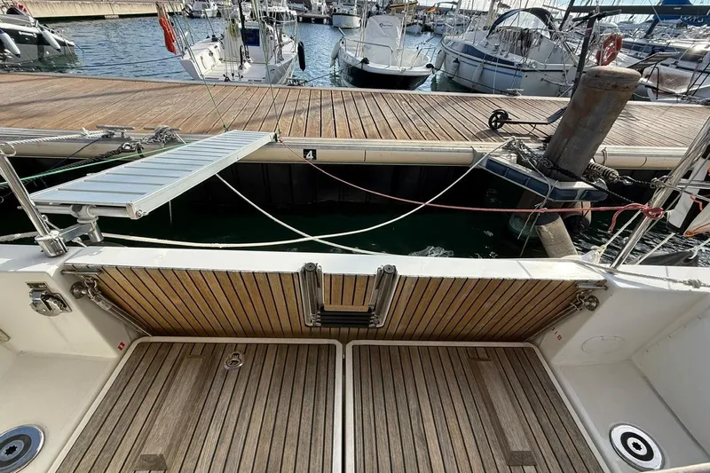 Marine Services S.a.s. Di Berruto Claudia Yacht Photos Pics Jeanneau Sun Odyssey 349, 2017 model, docked with wooden deck and gangway.