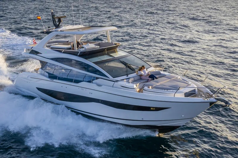 Bahari Yacht Photos Pics Luxurious 2020 Pearl 62 yacht cruising on open water, featuring sleek design and spacious deck.