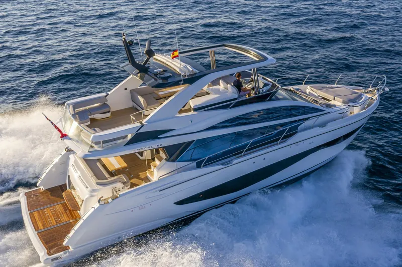 Bahari Yacht Photos Pics Luxurious 2020 Pearl 62 yacht cruising on open sea, showcasing sleek design and spacious deck.