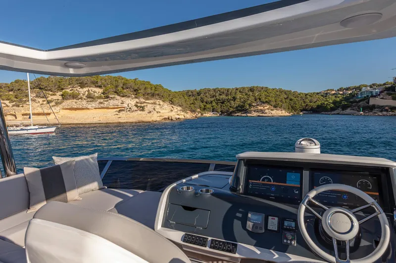 Bahari Yacht Photos Pics Luxurious Pearl 62 yacht interior with scenic coastal view, 2020 model.