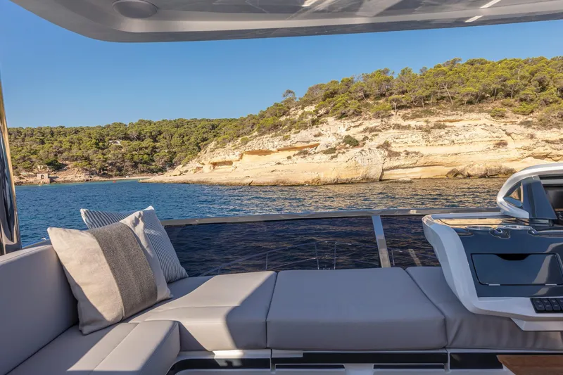 Bahari Yacht Photos Pics Luxurious Pearl 62 yacht interior with scenic coastal view, 2020 model.