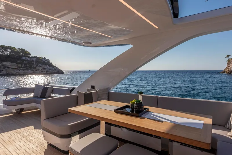 Bahari Yacht Photos Pics Luxurious Pearl 62 yacht deck with elegant seating, ocean view, and modern design, 2020 model.