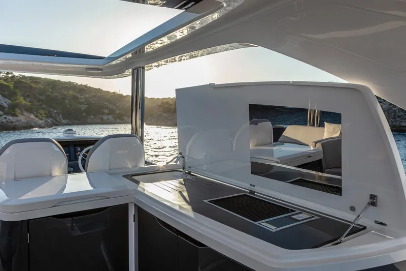 Bahari Yacht Photos Pics Luxurious 2020 Pearl 62 yacht interior with sleek design and scenic ocean view.