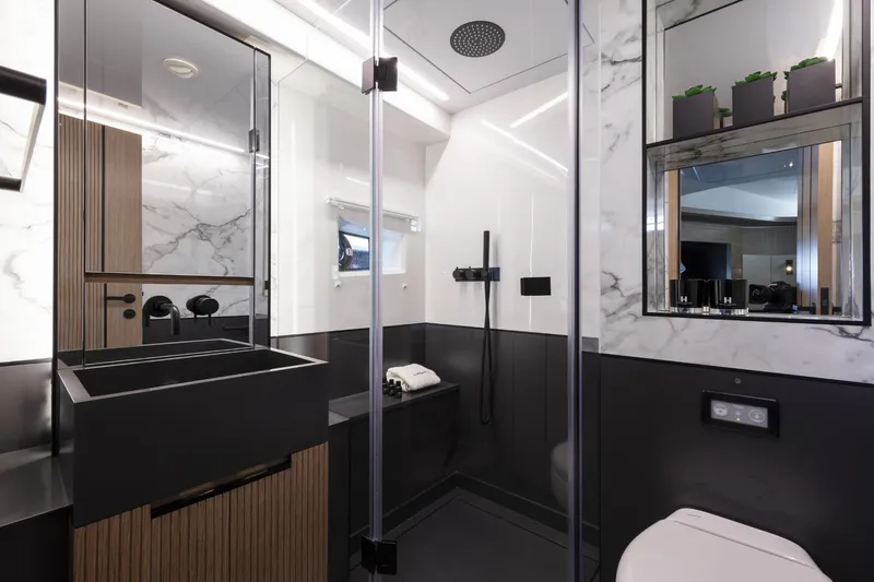 Bahari Yacht Photos Pics Modern yacht bathroom with marble accents, sleek fixtures, and contemporary design. Pearl 62, 2020 model.