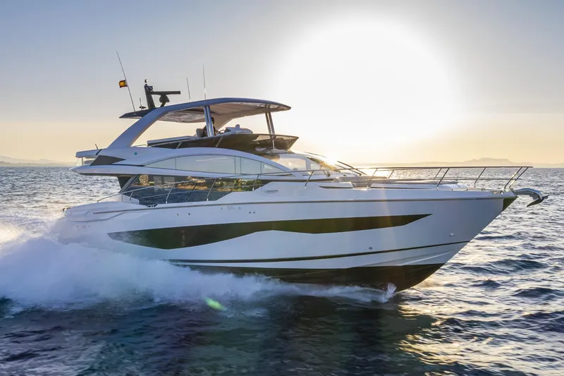 Bahari Yacht Photos Pics Luxurious 2020 Pearl 62 yacht cruising at sunset on open water.