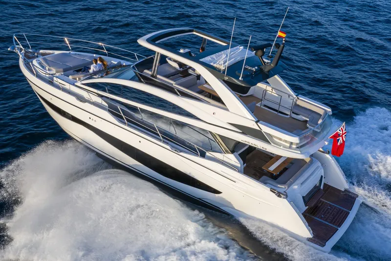 Bahari Yacht Photos Pics Luxurious 2020 Pearl 62 yacht cruising on open sea, showcasing sleek design and elegance.