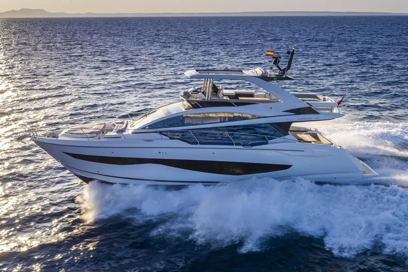 Bahari Yacht Photos Pics Luxurious 2020 Pearl 62 yacht cruising on open sea at sunset.
