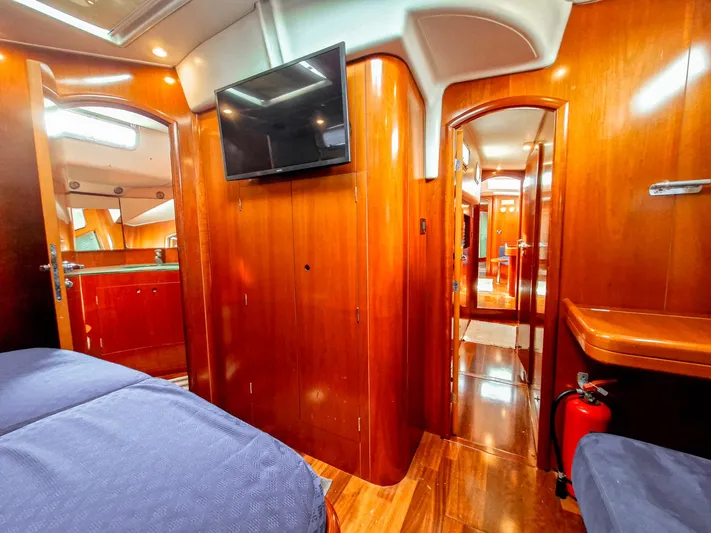  Yacht Photos Pics Luxurious interior of 2004 Beneteau 57 yacht with wood finish and modern amenities.