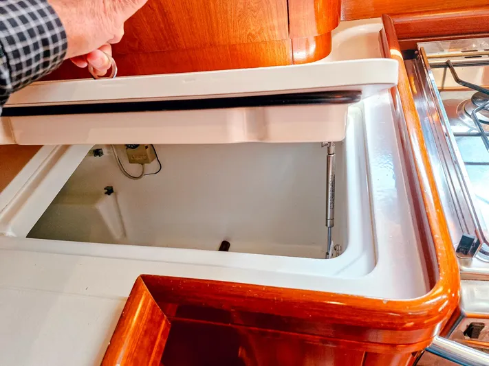  Yacht Photos Pics Interior view of a 2004 Beneteau 57 yacht showing a storage compartment.