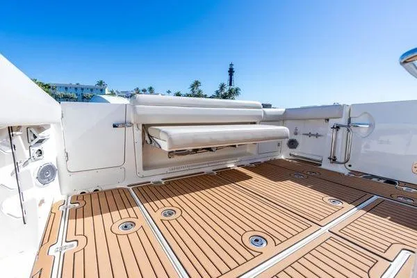  Yacht Photos Pics 2018 Boston Whaler 350 Outrage boat deck with seating, featuring teak flooring.