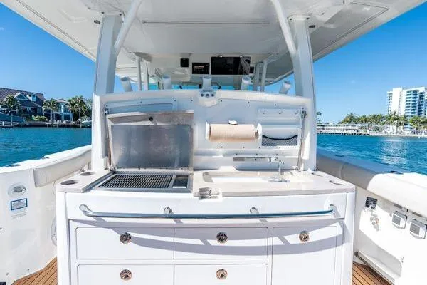  Yacht Photos Pics 2018 Boston Whaler 350 Outrage boat with outdoor kitchen and ocean view.