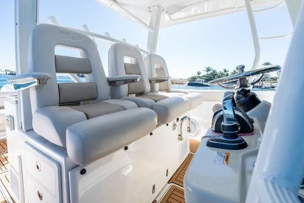  Yacht Photos Pics 2018 Boston Whaler 350 Outrage boat interior with plush seating and modern controls.