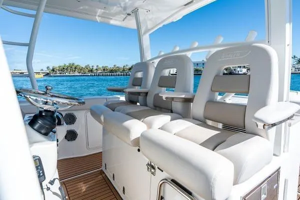  Yacht Photos Pics 2018 Boston Whaler 350 Outrage boat interior with luxurious seating and ocean view.