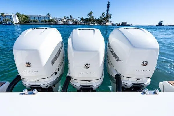  Yacht Photos Pics Triple Mercury outboard engines on a 2018 Boston Whaler 350 Outrage, ocean backdrop.