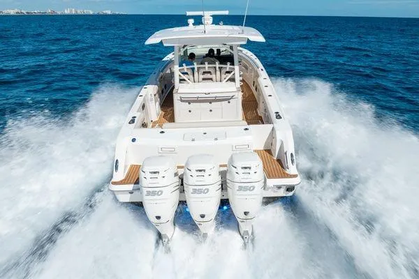  Yacht Photos Pics 2018 Boston Whaler 350 Outrage cruising on open ocean with triple engines.