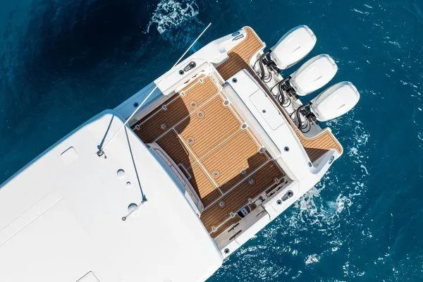  Yacht Photos Pics Overhead view of 2018 Boston Whaler 350 Outrage boat with triple engines on blue water.