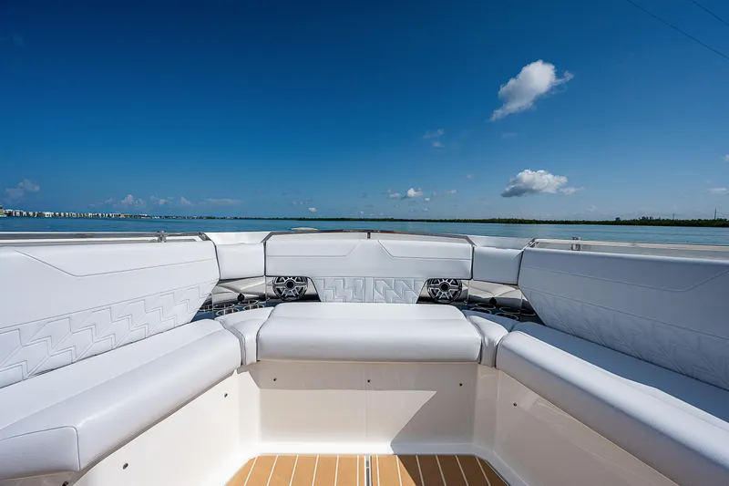 Legacy Yacht Photos Pics 2022 Formula 500 Super Sport Crossover boat interior with white seating and ocean view.