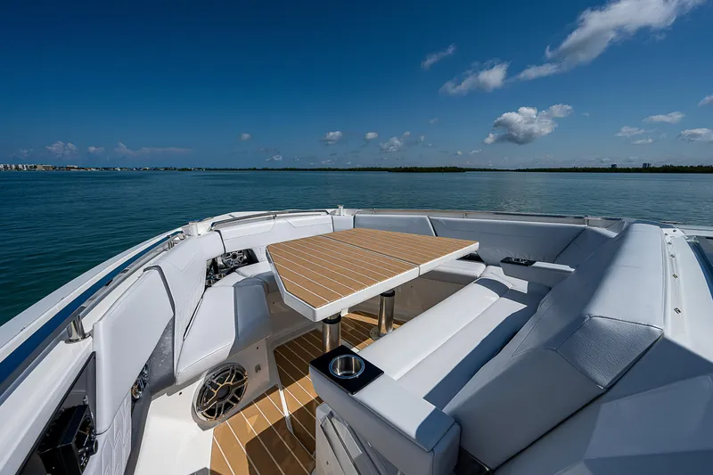Legacy Yacht Photos Pics 2022 Formula 500 Super Sport Crossover boat interior with seating and table on open water.